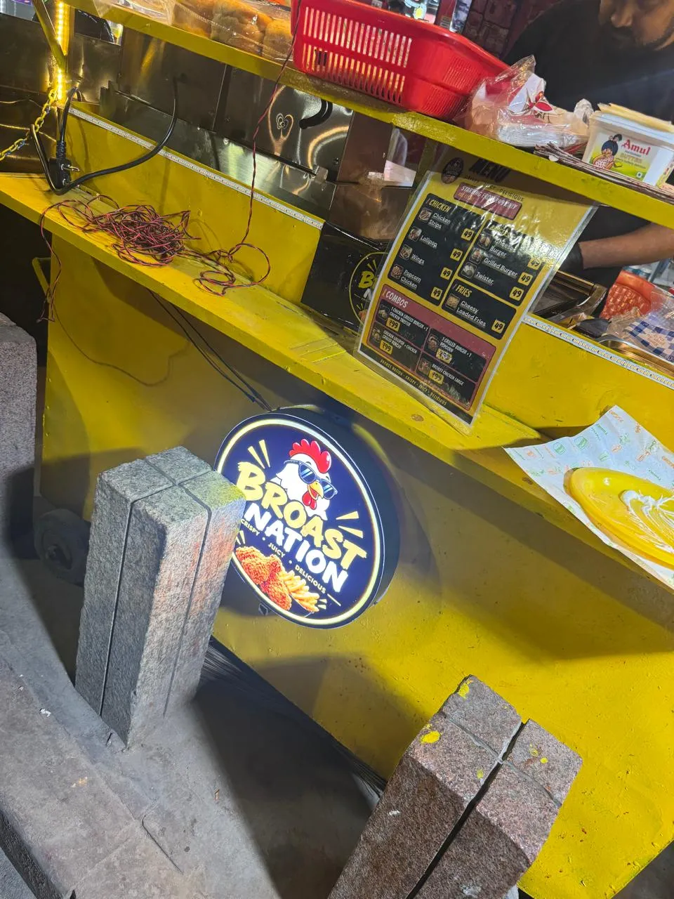 The Broast Nation cart's yellow counter and lit logo sign